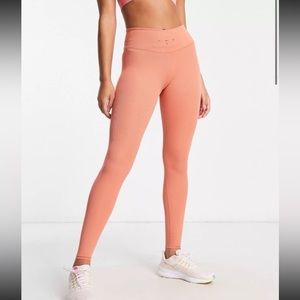 Large Nike Training Dri-FIT One Luxe 7/8 ribbed leggings in terracotta